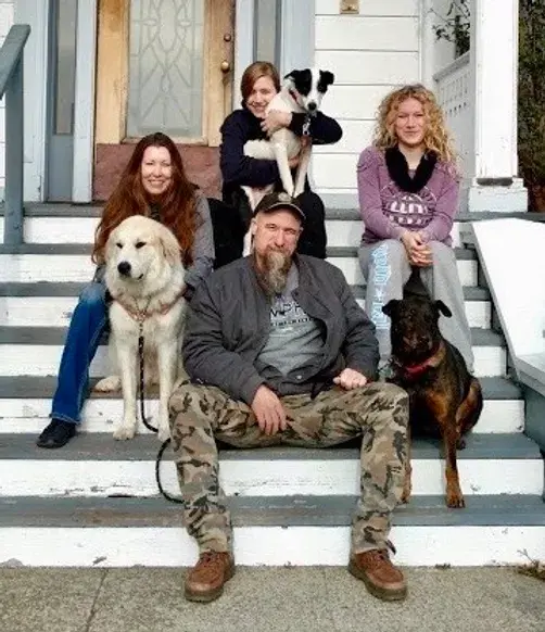 An image of the Cool Family and their dogs.